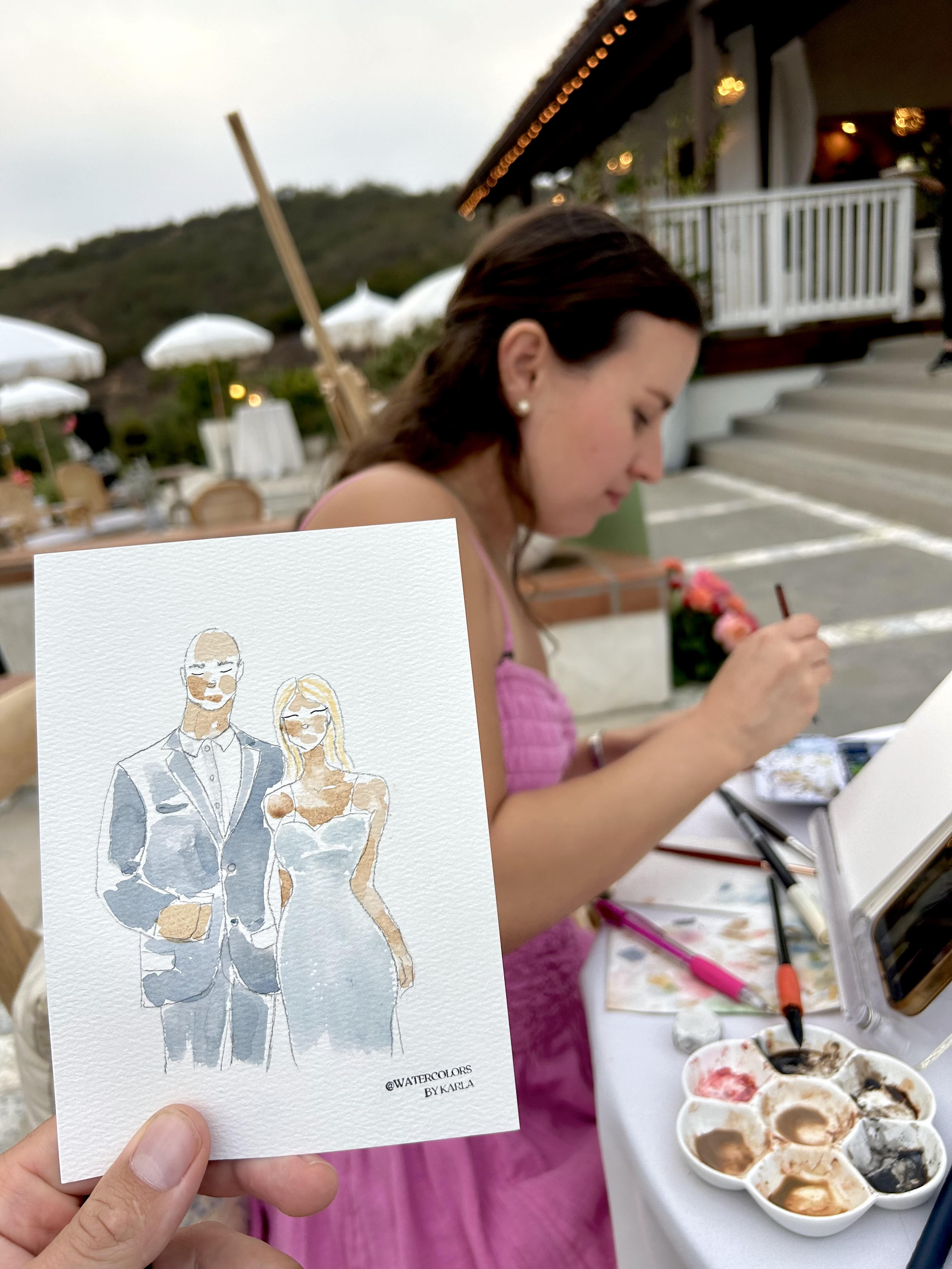 Water color portrait of couple touching heads and smiling at wedding.